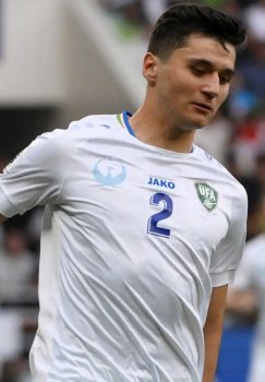 A serious football match between the national teams of Uzbekistan and Venezuela