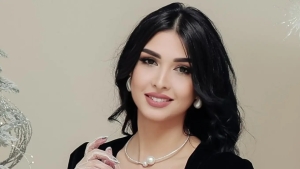 Marjona Mirzaaliyeva in a festive photo with her son