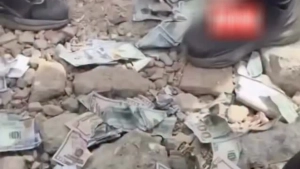 Venesueladagi vayronalar ostidan dollar bilan to'la seyf topildi