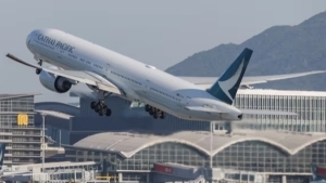 Passenger attempting to open airplane door apprehended