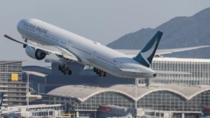 Passenger attempting to open airplane door apprehended