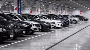 What caused the sharp decline in the import of passenger cars to Uzbekistan?