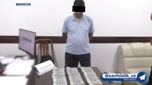 An internal affairs officer was caught taking a bribe in Bukhara