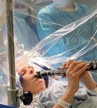 Woman Playing Clarinet with Parkinson's Disease Surgery