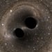 The collision of two black holes determined gravity