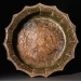 Lead container in the shape of a flower petal returned to Uzbekistan